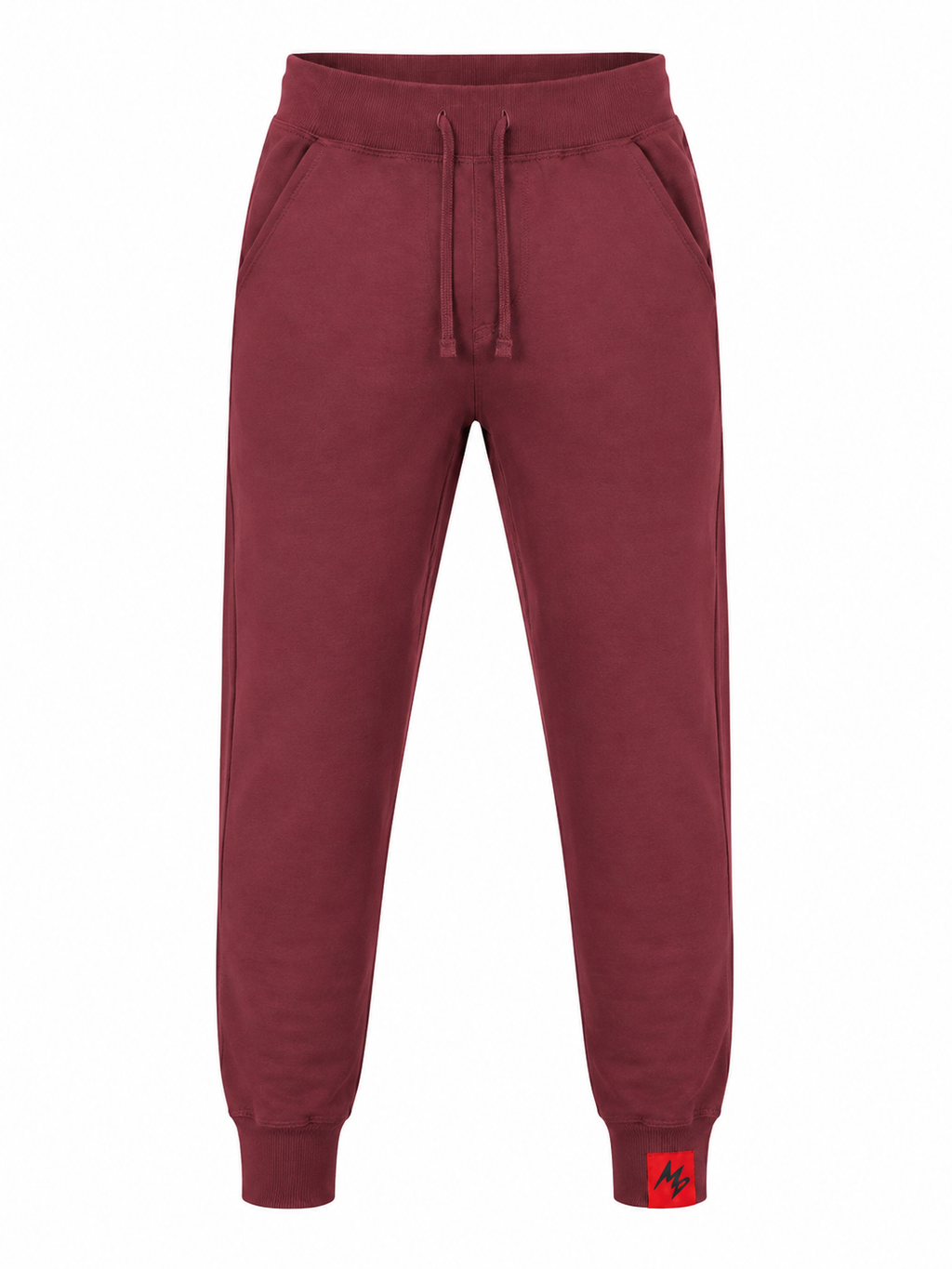 A pair of jogger sweatpants in a deep burgundy red, featuring an elastic waistband with a drawstring, side pockets, and ribbed cuffs. A small red square patch with a black logo is visible on the lower left cuff.