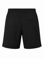 Black athletic shorts with an elastic waistband and a side pocket, shown from the back on a white background.