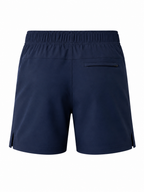 A pair of navy blue athletic shorts shown from the back, featuring an elastic waistband and a zippered pocket on the right side, set against a plain white background.