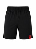 Black athletic shorts with an elastic waistband and a small red square logo patch on the lower left hem, shown against a plain white background.